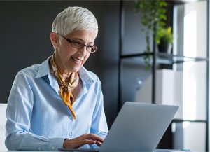 Woman using a laptop from home