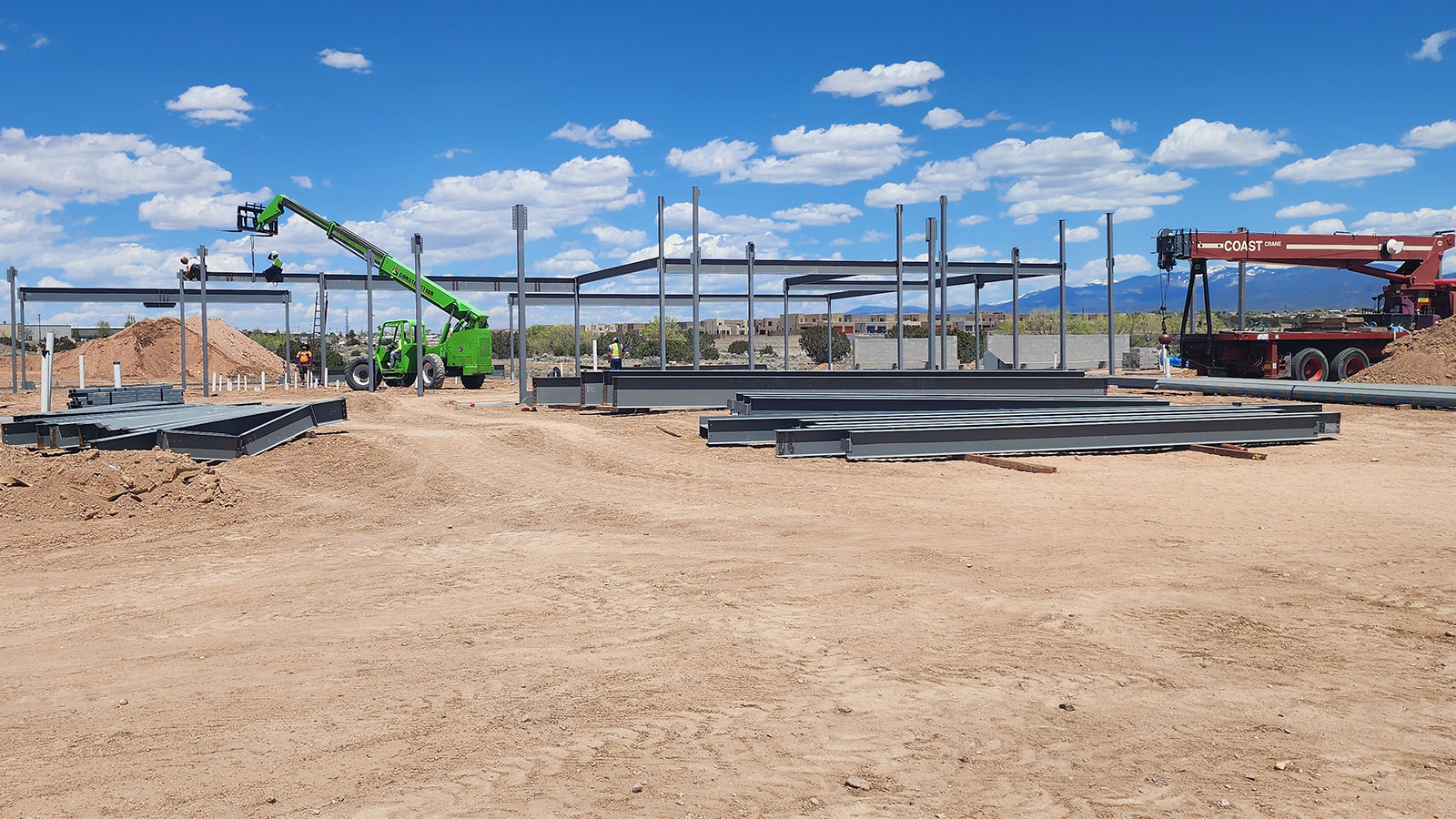 ERB building construction with steel beams framing work area.