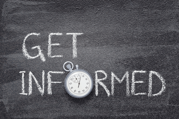chalkboard with word get informed with the letter O being a stopwatch.